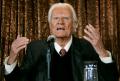 FILE PHOTO: Evangelist Billy Graham speaks to members of the media at a news conference in New York, U.S. June 21, 2005.  REUTERS/Mike Segar/File Photo