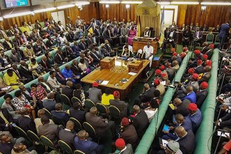 -In set is the ruling majority government side (left) the opposition side (right) putting on red huts and (Central) are independent MPs during the presidential age limit debate.