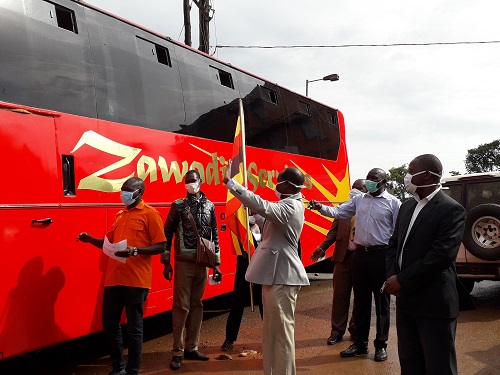 Uganda Cancer Institute Management Led (UCI) Executive Director , Dr Jackson Orem Flagging off over 70 stranded Cancer outpatients due to Lock-down to Eastern Route Last Month.