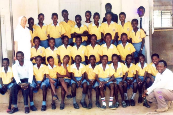 The Candidates of Primary Seven Class of 1994 shortly before PLE together with their teachers and headteachers , Sr Guliana